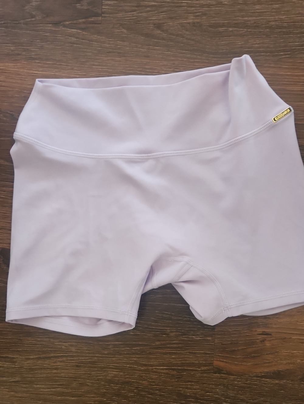 Cleo Harper High-Rise Bike Shorts in Light Lavender with Gold Logo
